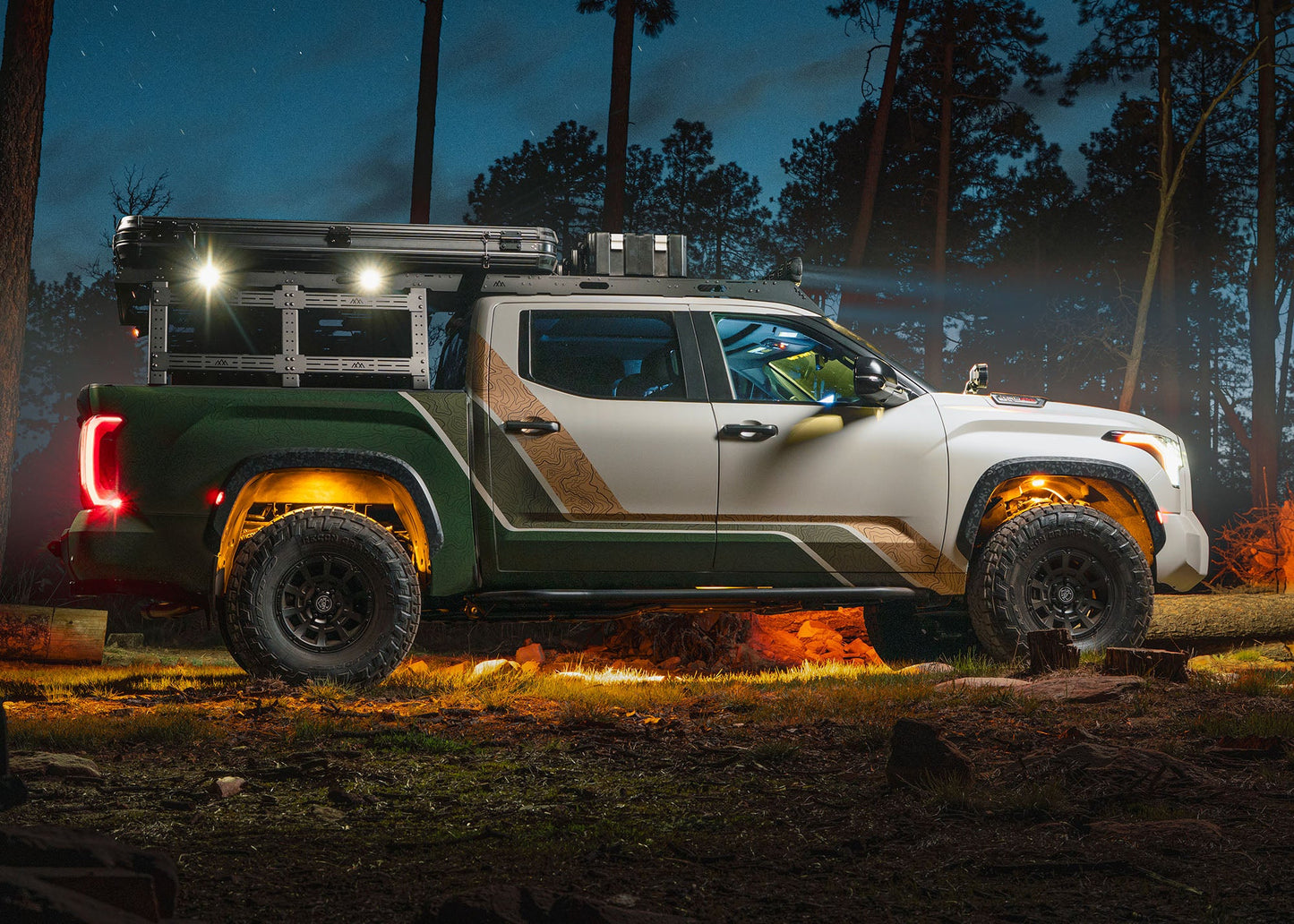 Backwoods Adventure Mods Bed Rack DRIFTR Topper cargo carrier add-on for 2022+ 3rd Gen Toyota Tundra truck bed rack with off road lights installed on the topper