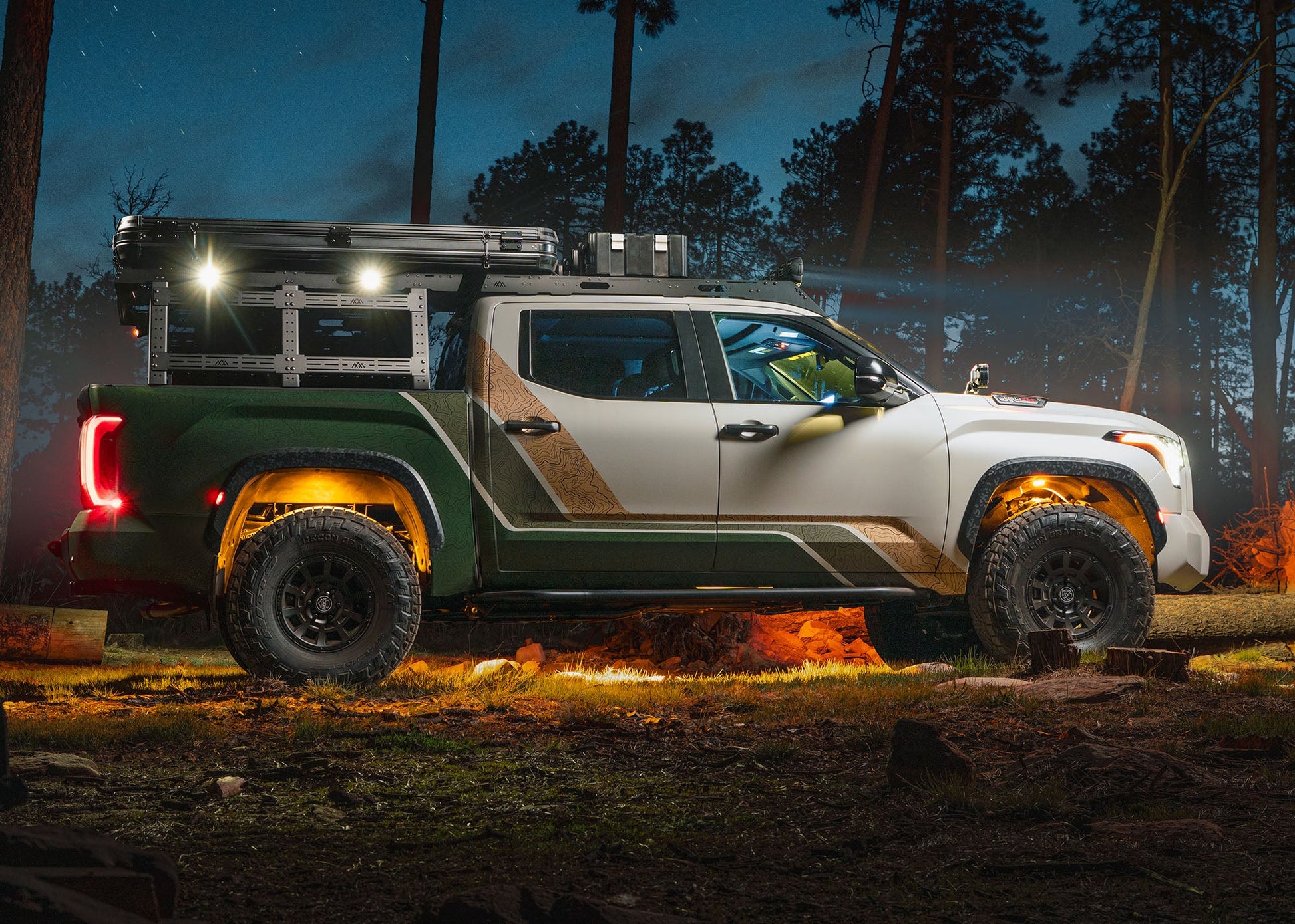 Backwoods Adventure Mods Bed Rack DRIFTR Topper cargo carrier add-on for 2022+ 3rd Gen Toyota Tundra truck bed rack with off road lights installed on the topper