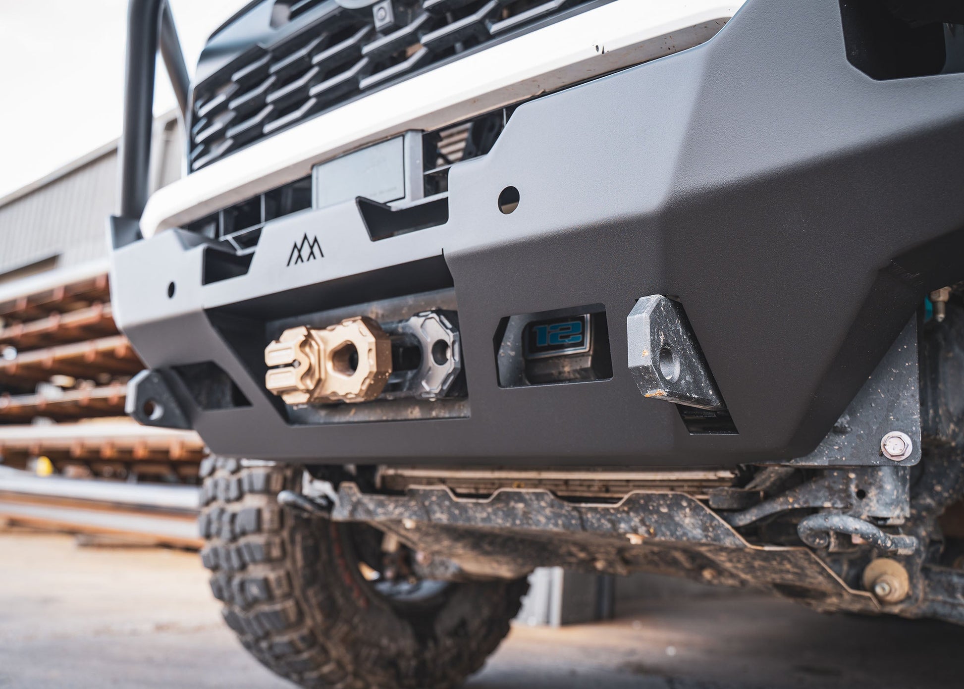 Close up of th winch mount and recovery points on the Backwoods Adventure Mods 4th Gen 2024 Toyota Tacoma Hi-Lite Overland Off Road Front Bull Bar Bumper