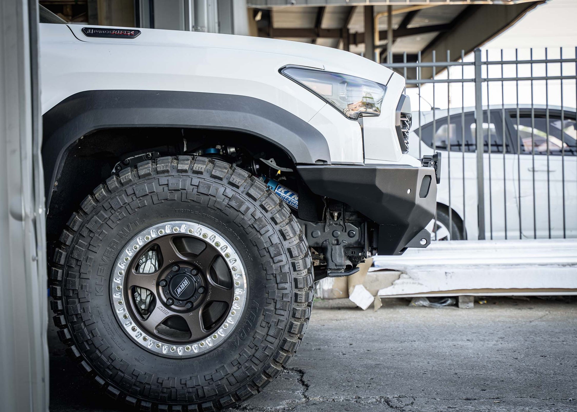 Side view of Backwoods Adventure Mods 4th Gen 2024 Toyota Tacoma Hi-Lite Overland Front Bumper installed for high clearance off road