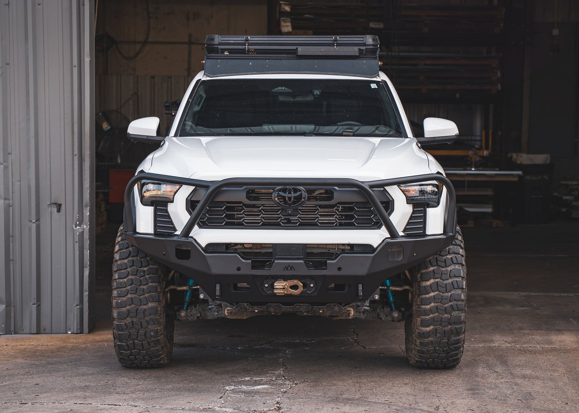 Backwoods Adventure Mods Hi-Lite Overland Front Bumper with Bull Bar installed on a 4th Gen 2024 Toyota Tacoma