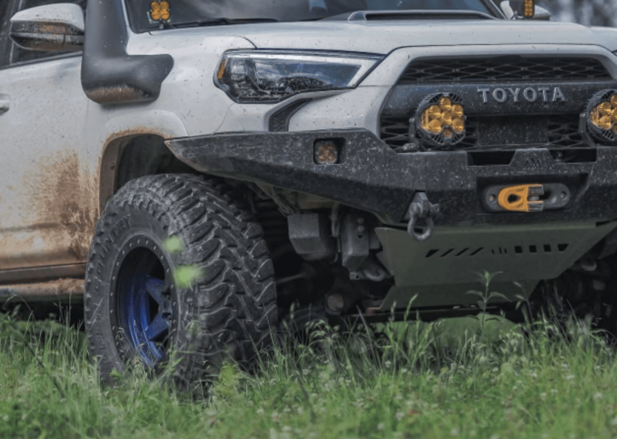 Installed Backwoods Adventure Mods 5th Gen Toyota 4Runner (2010-2022) Windshield Washer Fluid Reservoir Guard Skid Plate in use while off roading