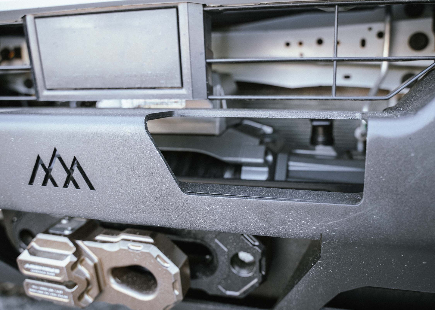 Close up of Backwoods Adventure Mods 2024 Toyota Tacoma 4th Gen Hi-Lite Overland aluminum Front Bumper installed for high clearance off road