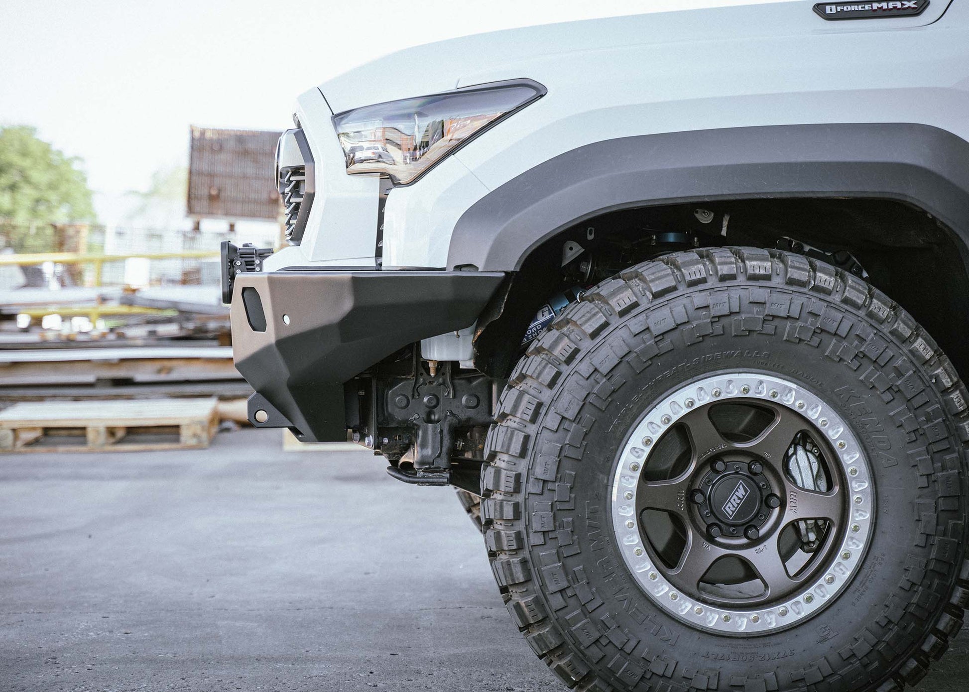 Driver-side view of Backwoods Adventure Mods 2024 Toyota Tacoma Hi-Lite hybrid aluminum Front Bumper