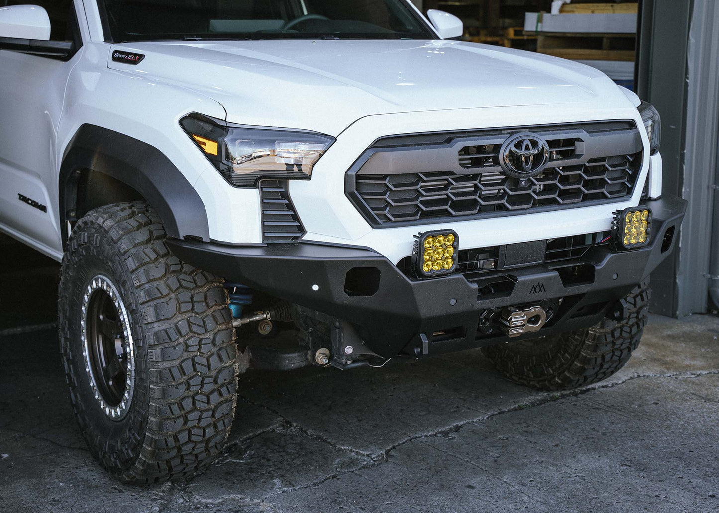 2024 Toyota Tacoma Hi-Lite hybrid aluminum Front Bumper by Backwoods Adventure Mods installed on a 4th gen Tacoma