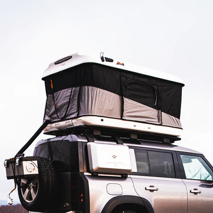 View of the pop up roof top tent on a land rover
