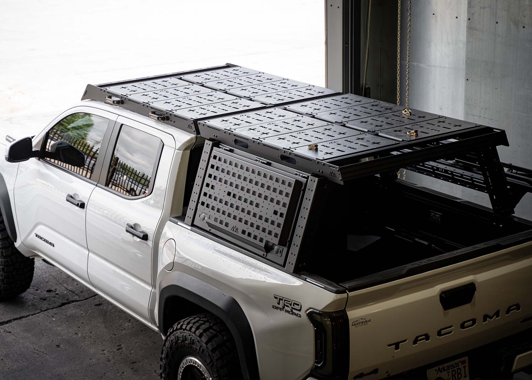 Backwoods Adventure Mods Bed Rack DRIFTR Topper cargo carrier add-on installed on a 3rd Gen Toyota Tacoma Overland truck bed rack with optional storage accessories