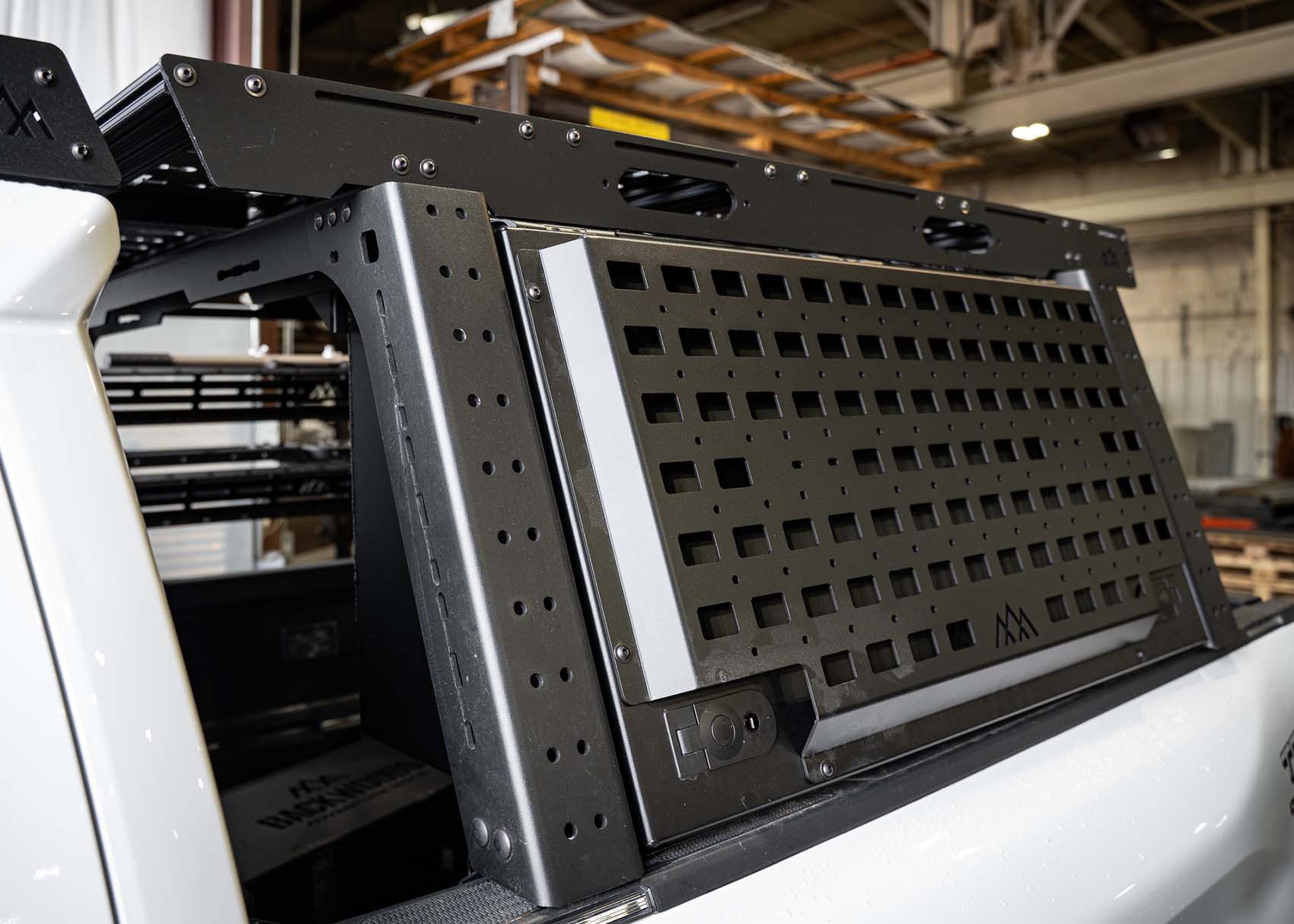 Front image of the Backwoods Adventure Mods Bed Rack DRIFTR Topper cargo carrier add-on for 2005+ Toyota Tacoma truck bed rack