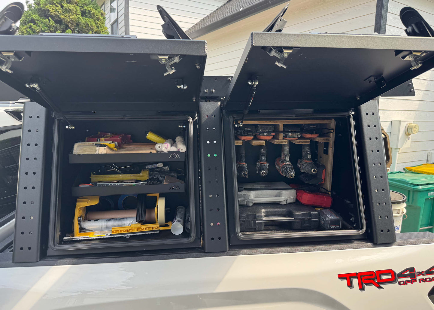 Customer using the Backwoods Adventure Mods Toyota Tundra Aluminum Bed Rack Storage Box to organize construction tools and painting equipment in the bed rack on their white 3rd Gen Toyota Tundra
